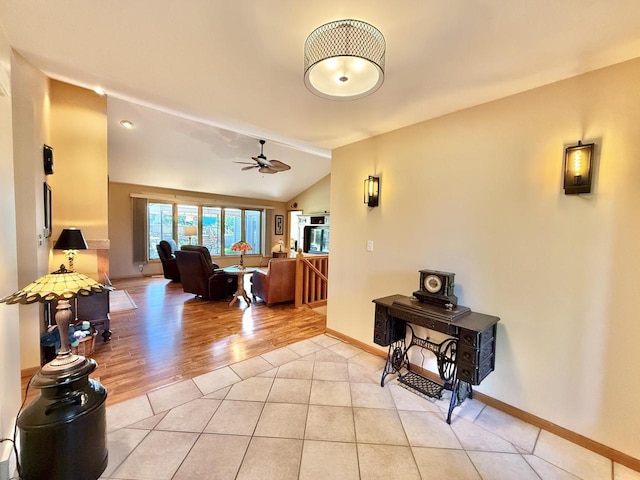 7975 Summit Dr, Delavan, WI 53115 - living area with ceiling fan, light tile patterned floors, and lofted ceiling