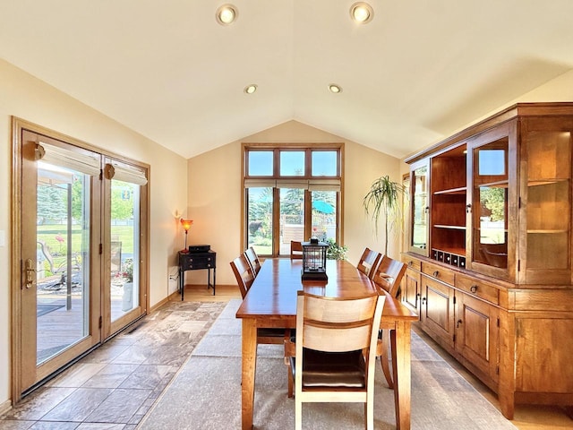 7975 Summit Dr, Delavan, WI 53115 - dining area featuring lofted ceiling, recessed lighting, and light stone finish floors
