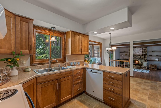 1512 David Ln, Waukesha, WI 53189 - kitchen featuring dishwasher, a peninsula, brown cabinetry, decorative light fixtures, and light countertops
