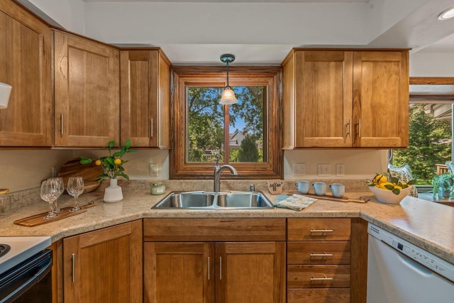 1512 David Ln, Waukesha, WI 53189 - kitchen featuring dishwasher, light countertops, range with electric stovetop, brown cabinetry, and decorative light fixtures