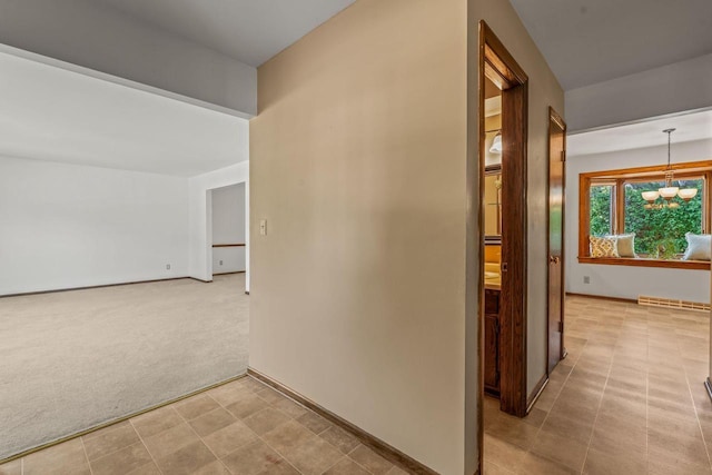 1512 David Ln, Waukesha, WI 53189 - hallway with a chandelier and carpet floors