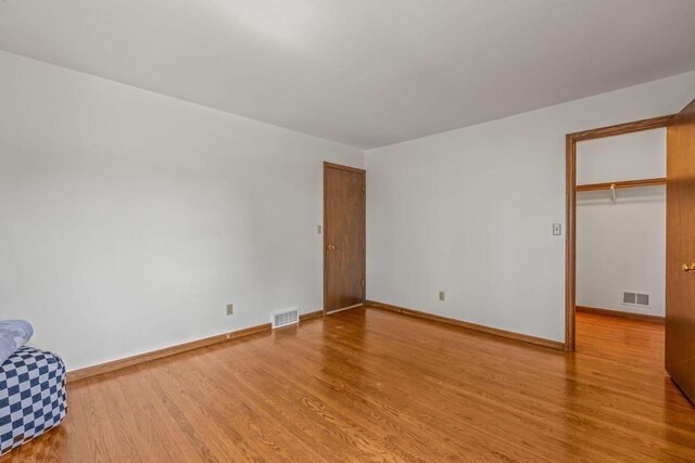 1512 David Ln, Waukesha, WI 53189 - unfurnished bedroom with wood finished floors and baseboards