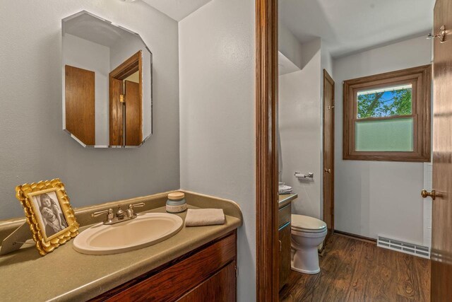 1512 David Ln, Waukesha, WI 53189 - bathroom featuring vanity and wood finished floors