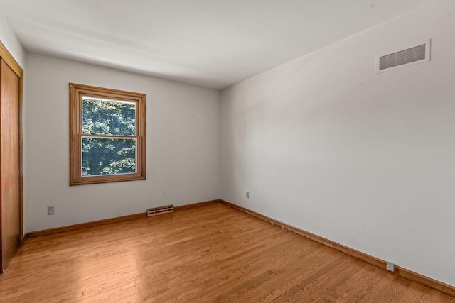 1512 David Ln, Waukesha, WI 53189 - unfurnished room with light wood-style floors and baseboards