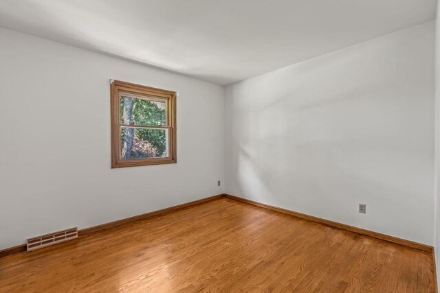 1512 David Ln, Waukesha, WI 53189 - empty room featuring light wood-style flooring and baseboards