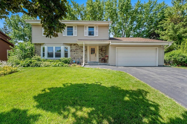 1512 David Ln, Waukesha, WI 53189 - view of front of property with asphalt driveway, an attached garage, a front yard, and brick siding