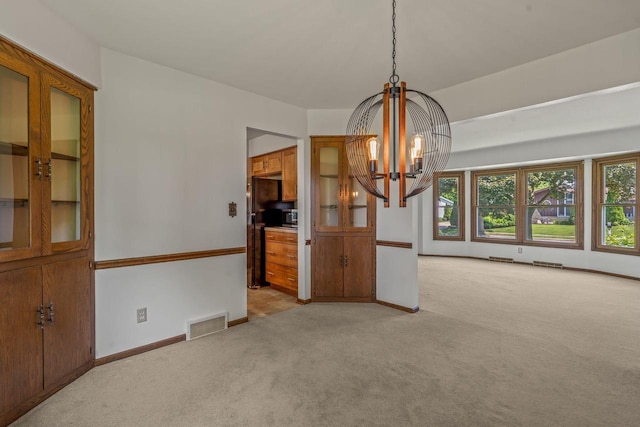 1512 David Ln, Waukesha, WI 53189 - unfurnished room featuring light carpet and a chandelier