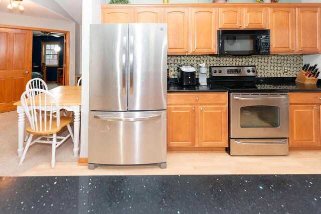 W162S7013 Olive Cir, Muskego, WI 53150 - kitchen with stainless steel appliances, tasteful backsplash, a ceiling fan, and dark stone countertops