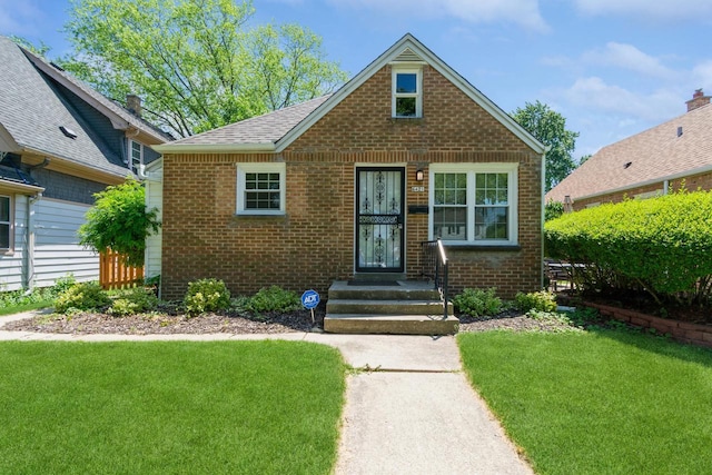 6421 W Girard Ave, Milwaukee, WI 53210 - bungalow with brick siding and a front yard
