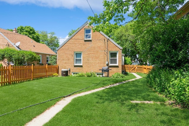 6421 W Girard Ave, Milwaukee, WI 53210 - back of property featuring brick siding and a fenced backyard