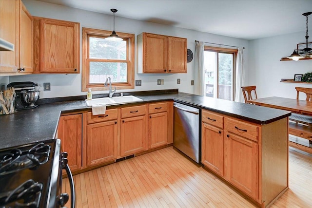 130 W Windsor Ave, Cottage Grove, WI 53527 - kitchen featuring range with gas stovetop, dishwasher, a peninsula, dark countertops, and pendant lighting