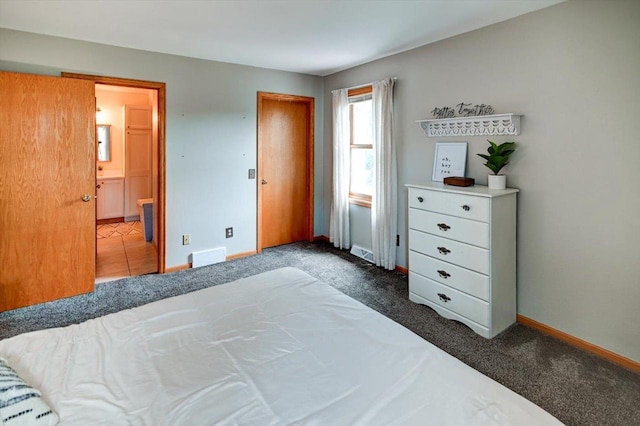 130 W Windsor Ave, Cottage Grove, WI 53527 - carpeted bedroom with baseboards and ensuite bath