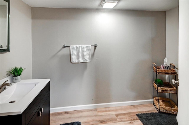 130 W Windsor Ave, Cottage Grove, WI 53527 - bathroom with wood finished floors and vanity