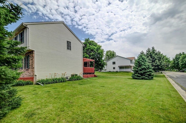 130 W Windsor Ave, Cottage Grove, WI 53527 - view of home's exterior with a lawn