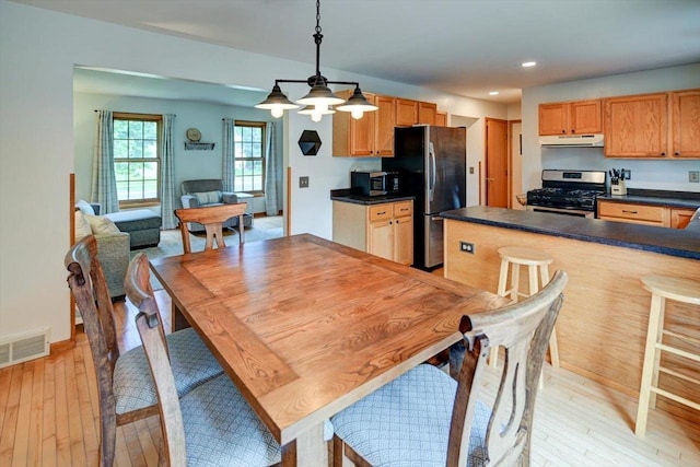 130 W Windsor Ave, Cottage Grove, WI 53527 - dining room featuring light wood finished floors, recessed lighting, and a chandelier
