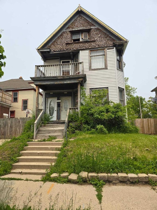 2622 W Vine St, Milwaukee, WI 53205 - view of front of house with a balcony and a porch