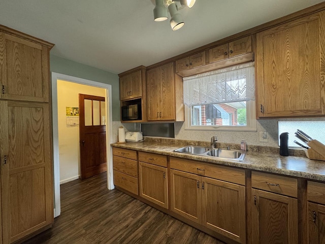 34 Elm Street N, St, La Crescent, MN 55947 - kitchen with dark wood finished floors, brown cabinetry, black microwave, and a chandelier