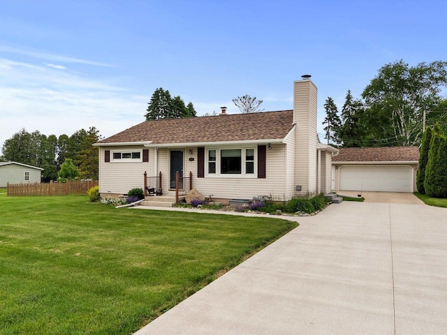 3715 N 17th St, Sheboygan, WI 53083 - view of front facade with an outdoor structure, a chimney, and a detached garage