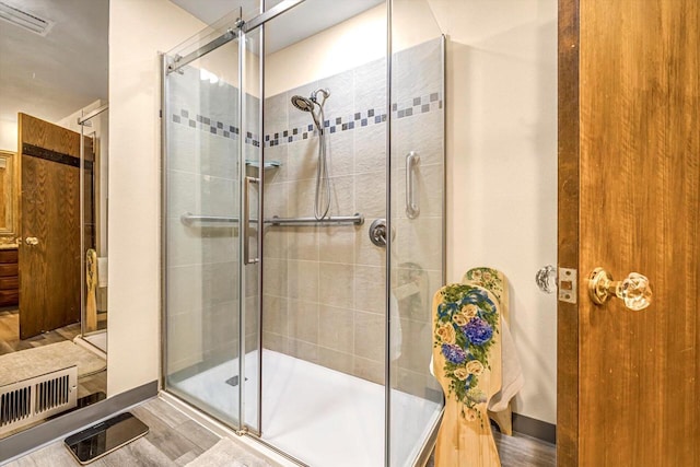 1450 Weber Ct, Hartland, WI 53029 - bathroom with a stall shower and wood finished floors