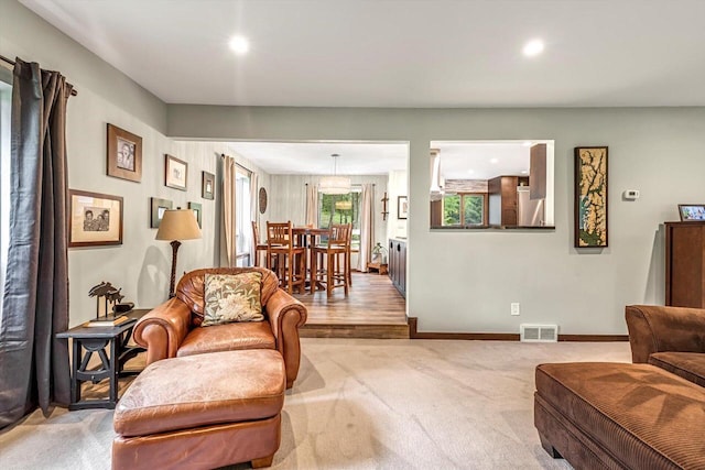 1450 Weber Ct, Hartland, WI 53029 - living area with recessed lighting and light colored carpet