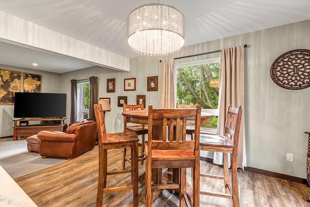 1450 Weber Ct, Hartland, WI 53029 - dining room with wood finished floors and a chandelier