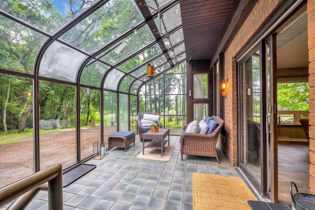 1450 Weber Ct, Hartland, WI 53029 - sunroom with vaulted ceiling and outdoor lounge area