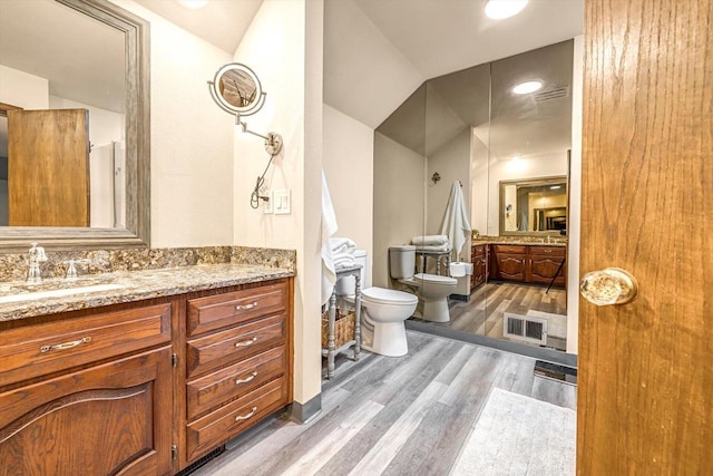 1450 Weber Ct, Hartland, WI 53029 - bathroom with a bidet, wood finished floors, and vanity