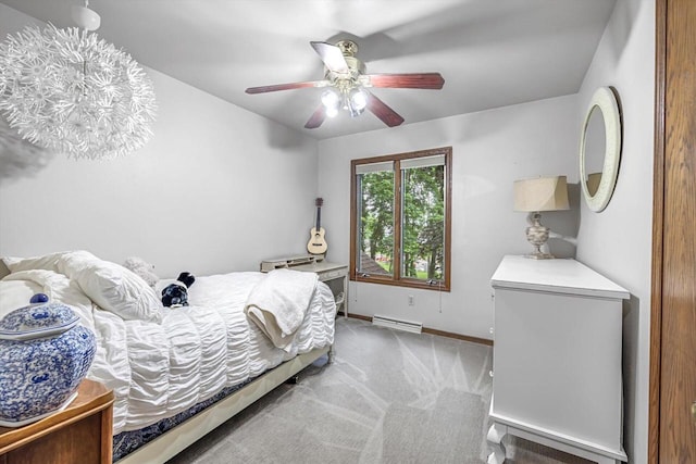 1450 Weber Ct, Hartland, WI 53029 - bedroom with carpet floors, a baseboard heating unit, and ceiling fan