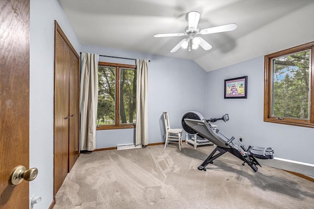 1450 Weber Ct, Hartland, WI 53029 - workout area featuring healthy amount of natural light, light colored carpet, a baseboard heating unit, vaulted ceiling, and ceiling fan