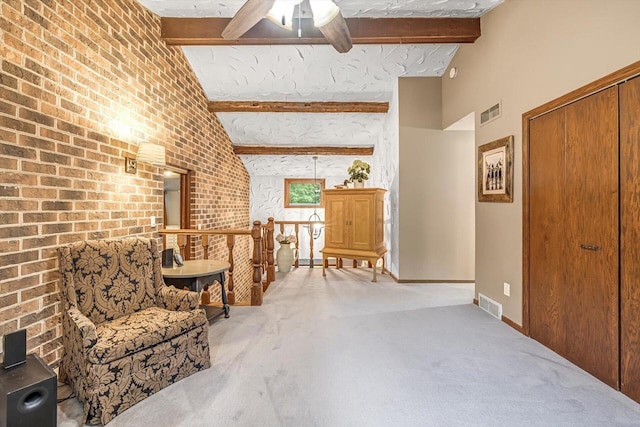 1450 Weber Ct, Hartland, WI 53029 - living area featuring carpet floors, beam ceiling, a ceiling fan, and high vaulted ceiling