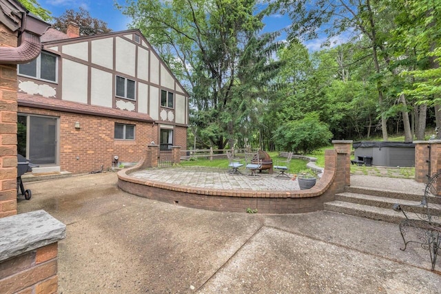 1450 Weber Ct, Hartland, WI 53029 - view of patio featuring an outdoor fire pit