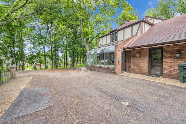 1450 Weber Ct, Hartland, WI 53029 - view of yard with a sunroom