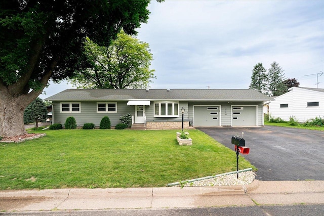 3720 Elm Dr, La Crosse, WI 54601 - ranch-style house with an attached garage, driveway, a front yard, and entry steps