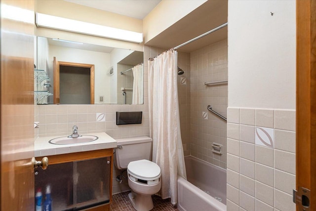 3720 Elm Dr, La Crosse, WI 54601 - full bath with tile walls, vanity, shower / bath combo with shower curtain, and tile patterned floors