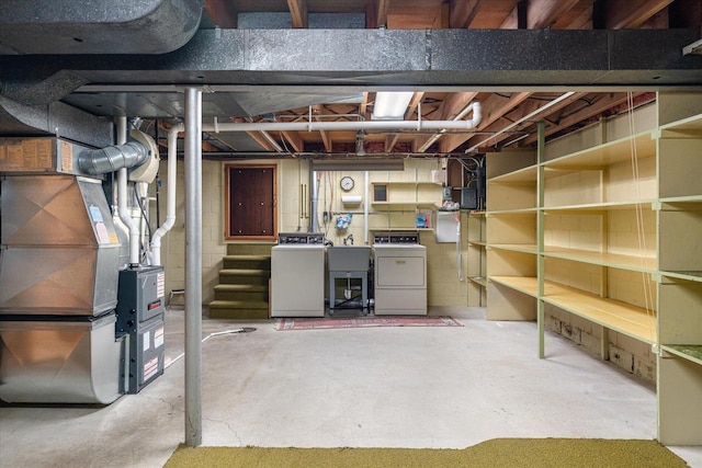 3720 Elm Dr, La Crosse, WI 54601 - unfinished basement featuring washer and clothes dryer and heating unit