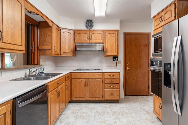 3720 Elm Dr, La Crosse, WI 54601 - kitchen featuring stainless steel appliances, extractor fan, light countertops, and brown cabinetry