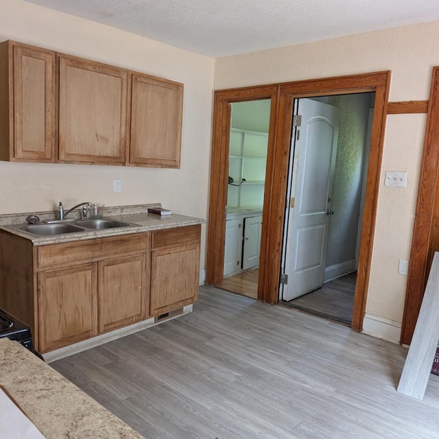 1920 W Vienna Ave, Milwaukee, WI 53206 - kitchen with light wood finished floors, light countertops, and a textured ceiling