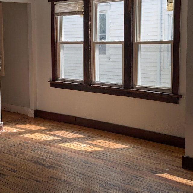 1920 W Vienna Ave, Milwaukee, WI 53206 - unfurnished room featuring hardwood / wood-style floors and baseboards