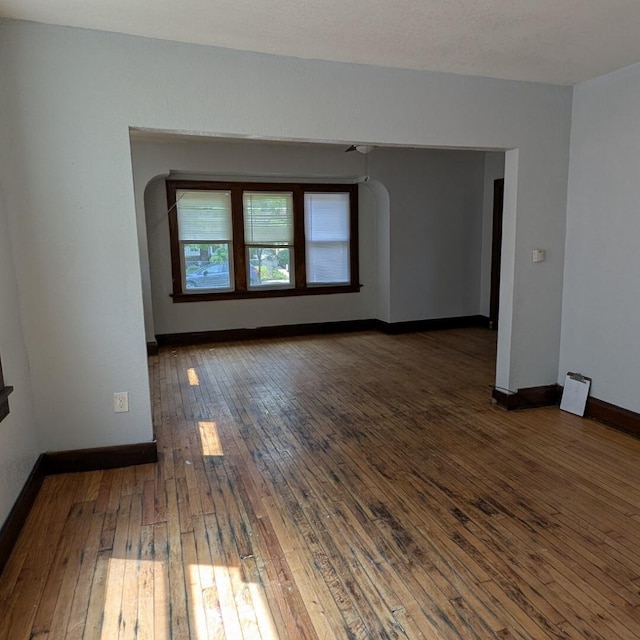 1920 W Vienna Ave, Milwaukee, WI 53206 - unfurnished room featuring hardwood / wood-style flooring and arched walkways