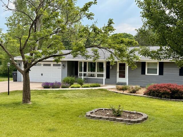 W254S6620 Ridge Rd, Waukesha, WI 53189 - ranch-style house featuring concrete driveway, a front lawn, and an attached garage