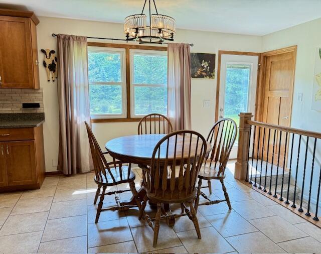 W254S6620 Ridge Rd, Waukesha, WI 53189 - dining space featuring healthy amount of natural light, a chandelier, and light tile patterned floors