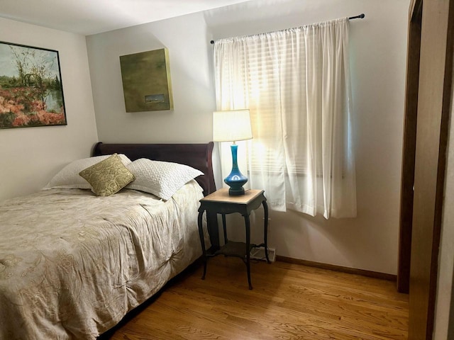W254S6620 Ridge Rd, Waukesha, WI 53189 - bedroom featuring wood finished floors and baseboards