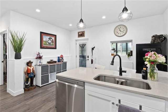4271 220th St, Cadott, WI 54727 - kitchen featuring dishwasher, white cabinets, wood finished floors, light stone countertops, and pendant lighting