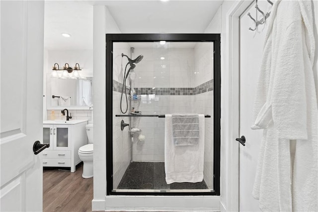 4271 220th St, Cadott, WI 54727 - full bath featuring a shower stall, wood finished floors, vanity, and recessed lighting