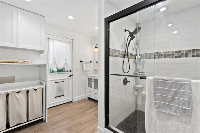 4271 220th St, Cadott, WI 54727 - full bath with a stall shower, wood finished floors, and recessed lighting