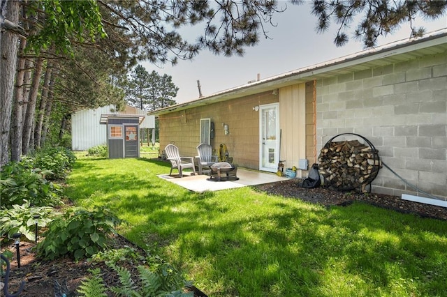 4271 220th St, Cadott, WI 54727 - view of yard with a patio area, an outdoor fire pit, and an outdoor structure