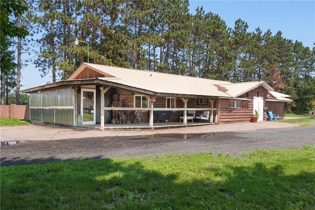 4271 220th St, Cadott, WI 54727 - view of front of property with a metal roof and gravel driveway