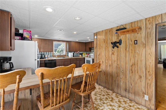 4271 220th St, Cadott, WI 54727 - dining area featuring wood walls, recessed lighting, and light flooring