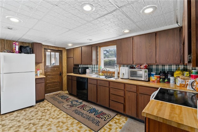4271 220th St, Cadott, WI 54727 - kitchen with black appliances, light flooring, recessed lighting, wooden counters, and tasteful backsplash