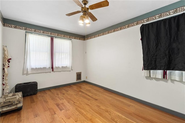 4271 220th St, Cadott, WI 54727 - empty room with light wood finished floors and a ceiling fan
